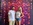 Guests posing in front of a colorful photo booth backdrop at an Outlaw Entertainment event in Charleston SC